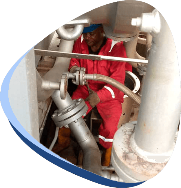 Folifod technician working on industrial piping and equipment